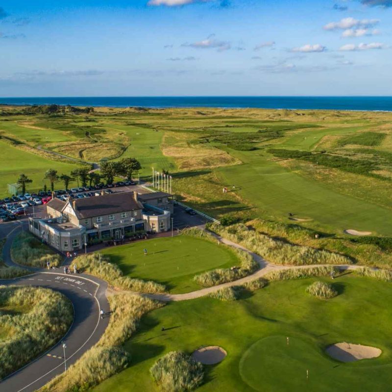 aerial shot of County Louth Golf Club clubhouse and course