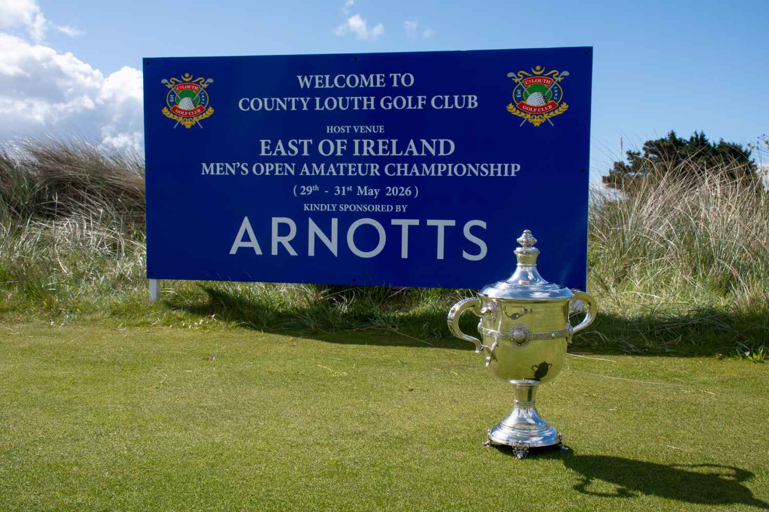 trophy in foreground with info on East of Ireland Championship in background sponsored by Arnotts